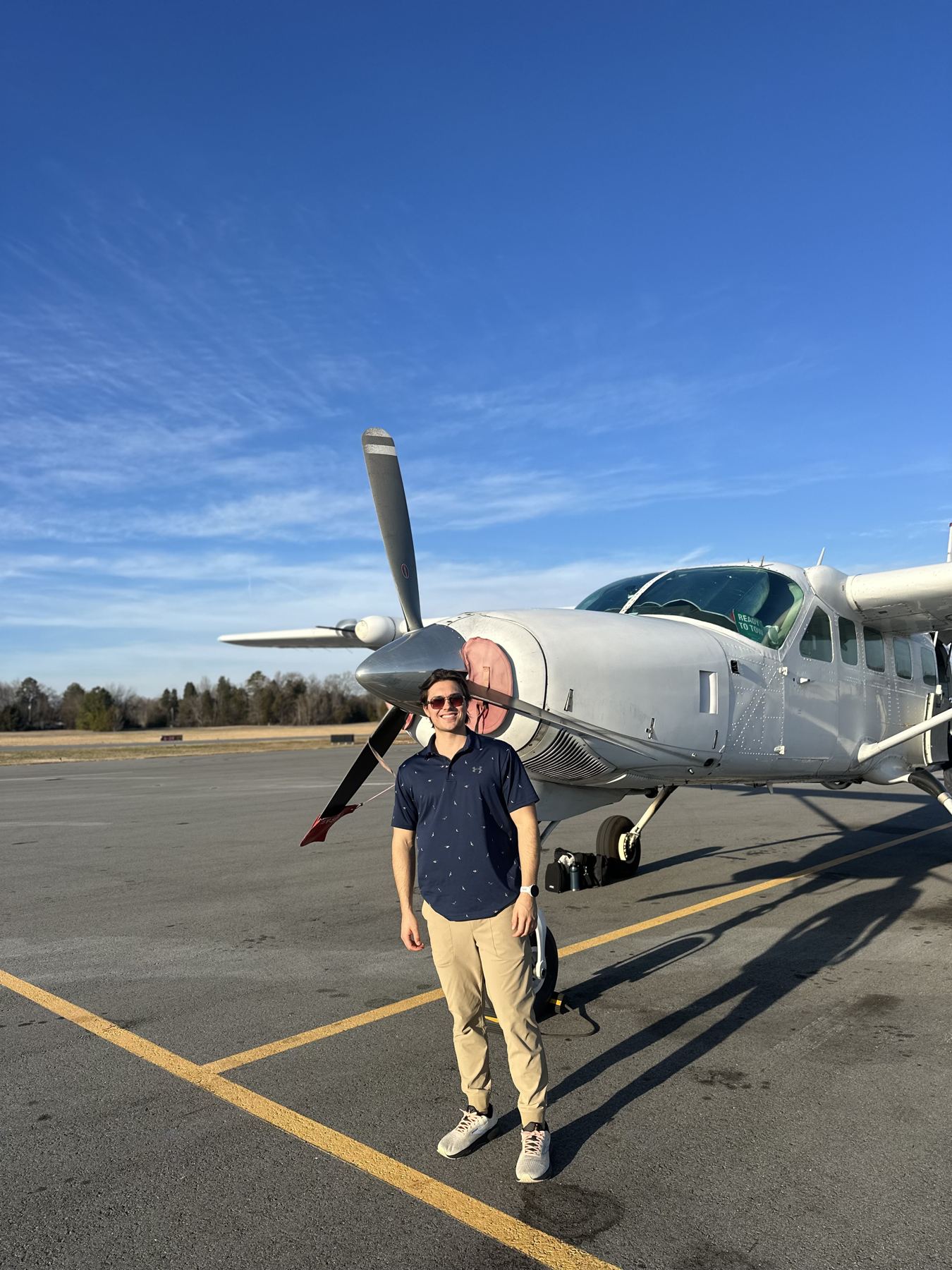 Ryan Park standing in front of a Cessna 208 Caravan