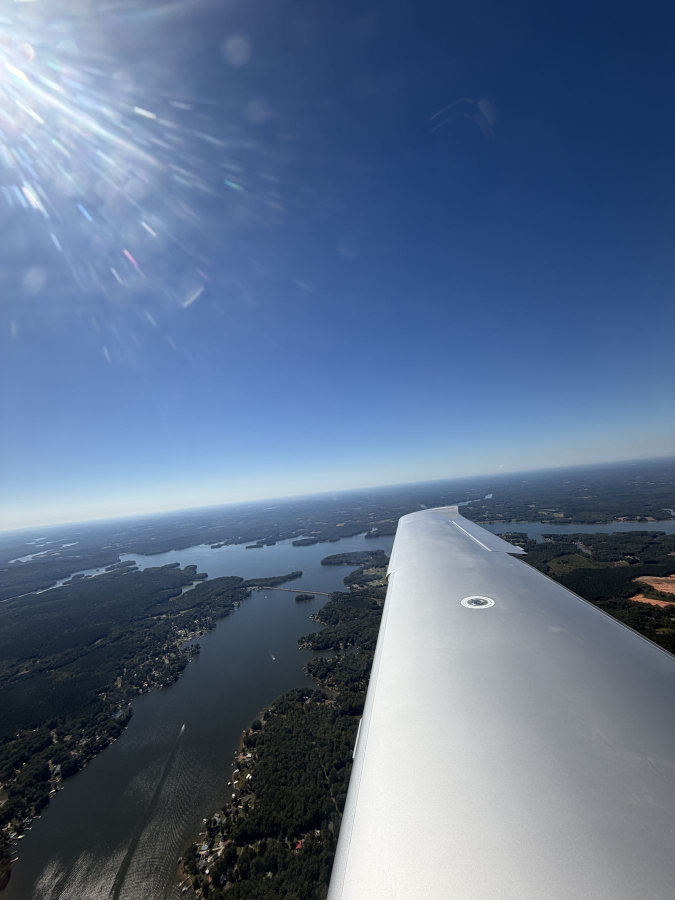 Cirrus wing above Lake Norman on a clear day